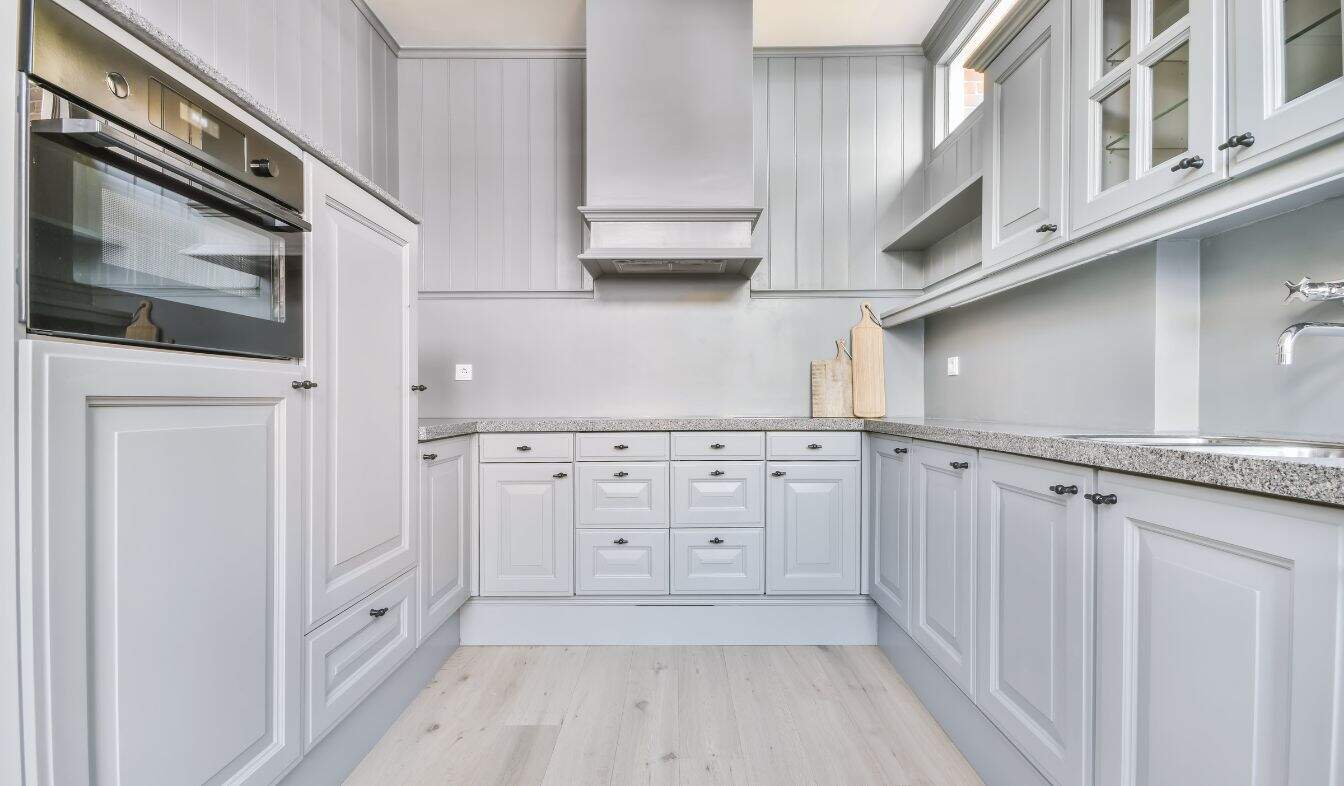 When Should You Consider Cabinet Refinishing a-luxury-kitchen-island-2025